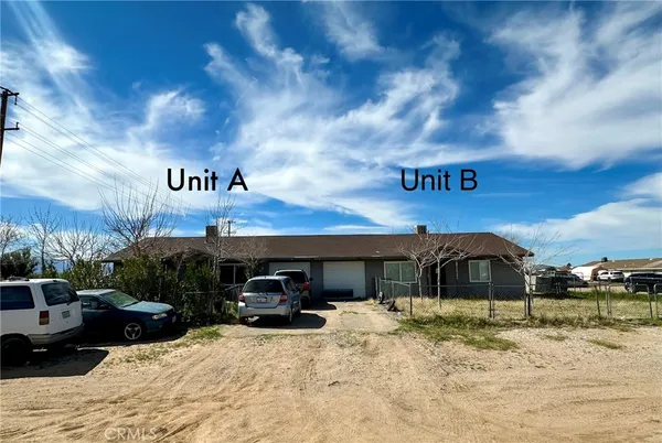 a view of a car park in front of house