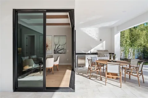a living room with a table and chairs