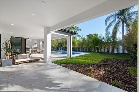 a view of a house with garden and patio