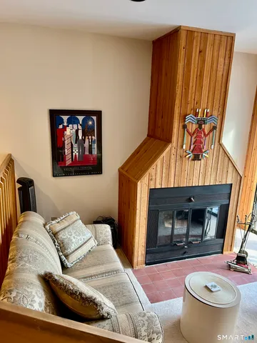 a bedroom with a bed and a fireplace