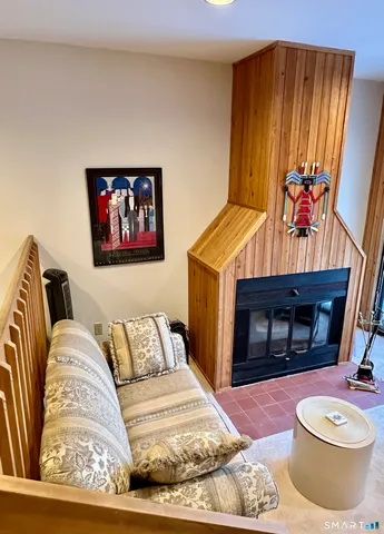 a bedroom with a bed and a fireplace