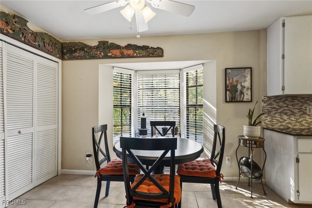 571 2nd Street Southeast Naples, FL 34117 - Photo 11 of 31 a view of a dining room with furniture and chandelier