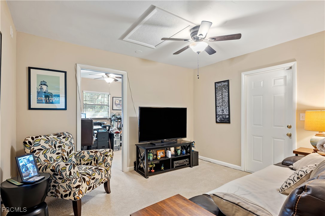 571 2nd Street Southeast Naples, FL 34117 - Photo 12 of 31 a living room with furniture and a flat screen tv