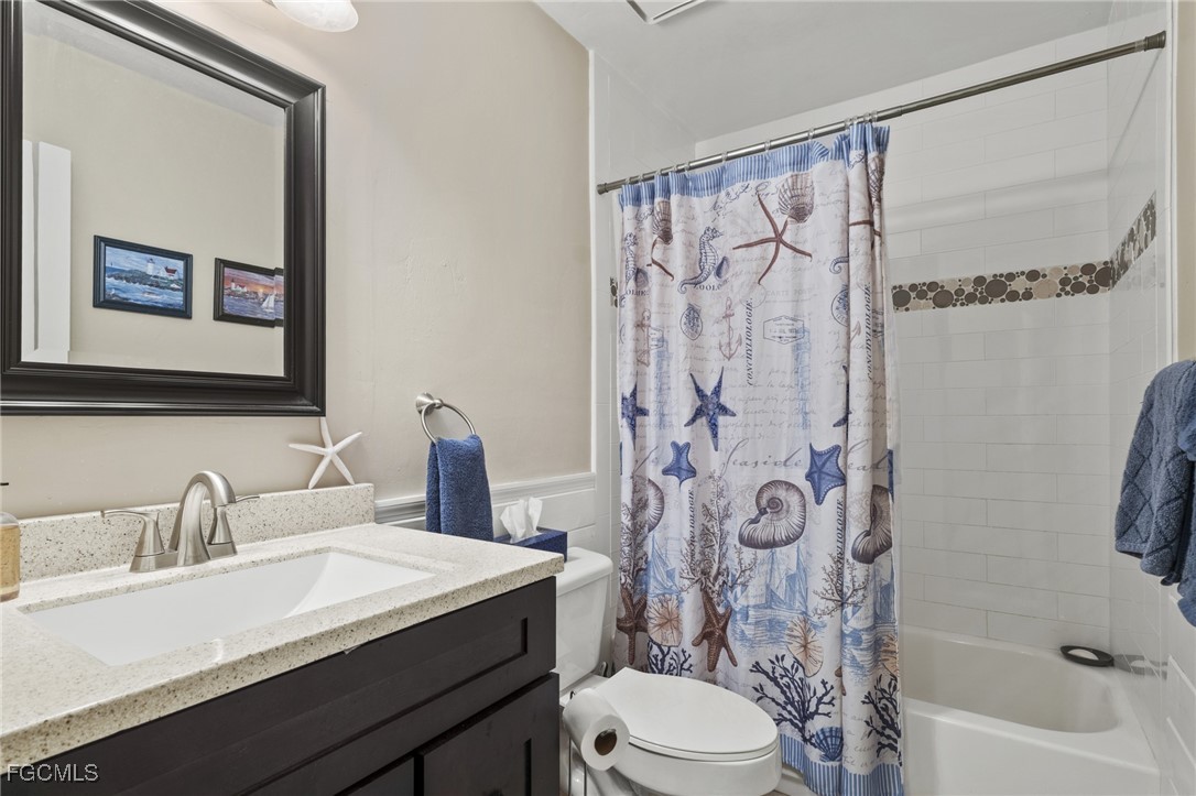 571 2nd Street Southeast Naples, FL 34117 - Photo 20 of 31 a bathroom with a sink a toilet and a bathtub