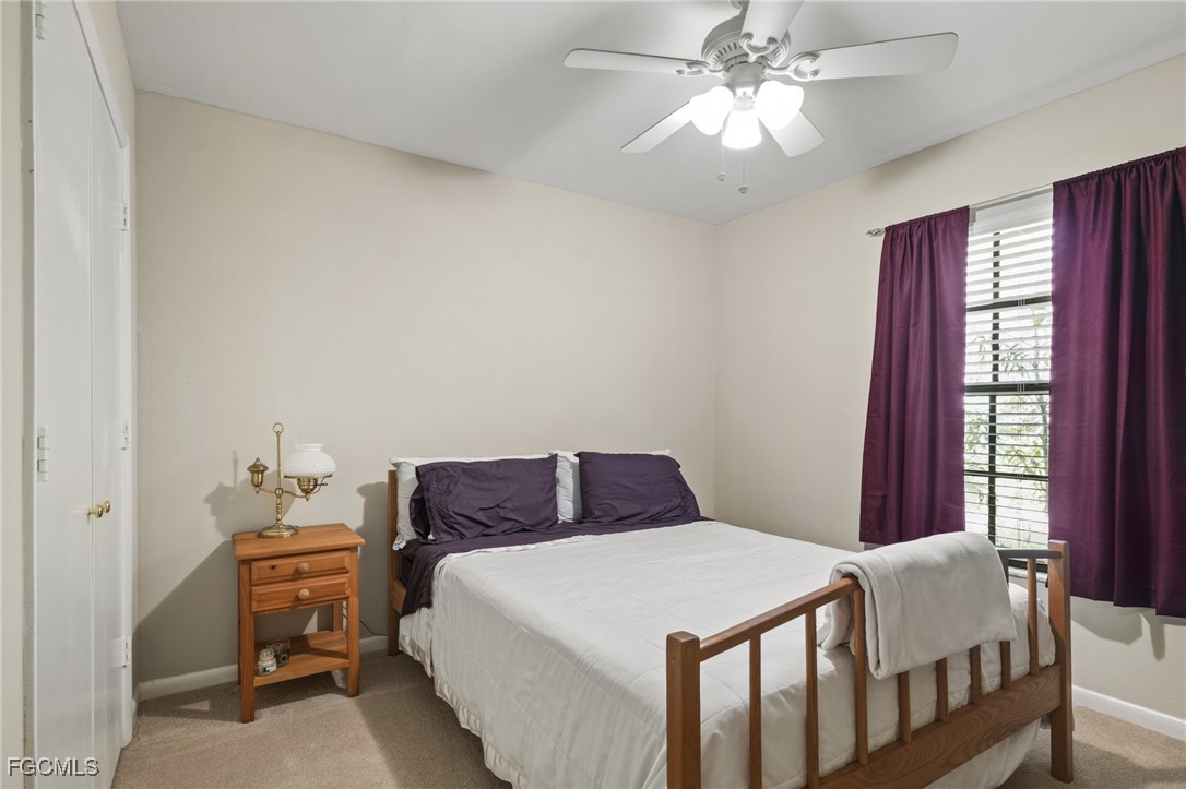 571 2nd Street Southeast Naples, FL 34117 - Photo 21 of 31 a bedroom with a bed and window