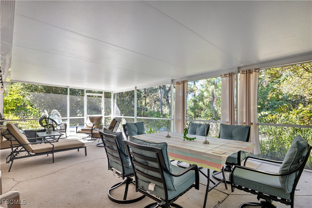 571 2nd Street Southeast Naples, FL 34117 - Photo 22 of 31 a living room with furniture and windows
