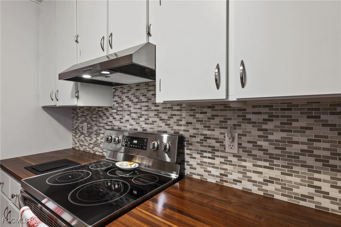 571 2nd Street Southeast Naples, FL 34117 - Photo 9 of 31 a stove top oven sitting inside of a kitchen