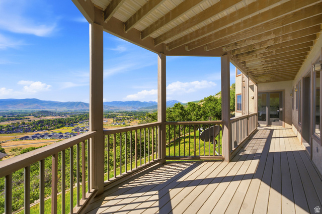 335 Bern Way Midway, UT 84049 - Photo 56 of 88 Expansive covered deck featuring composite decking and a wooden railing system