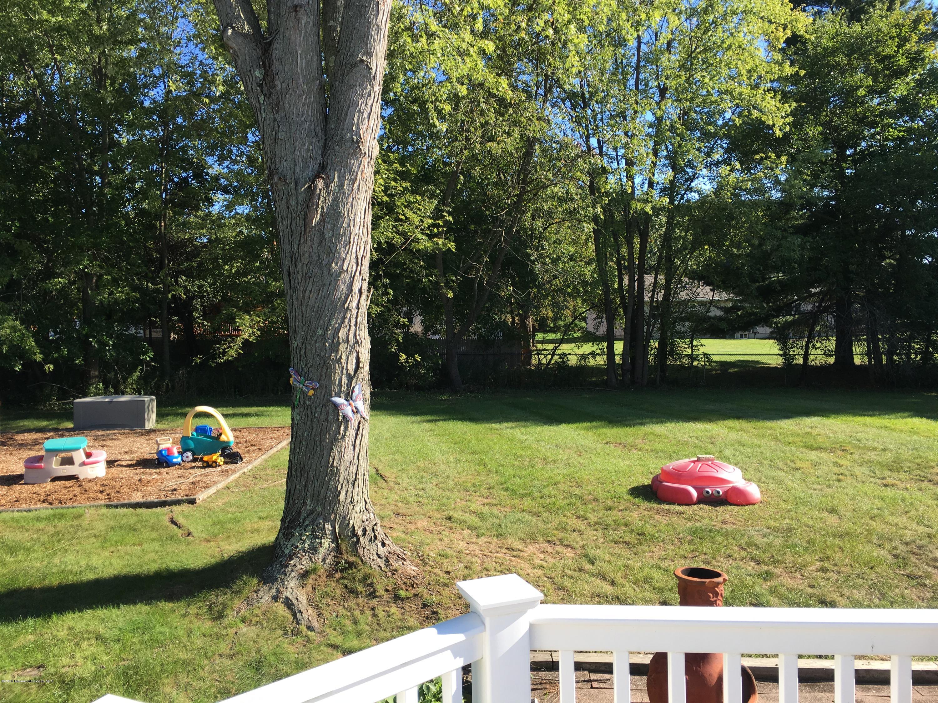 20 Coldspring Road Freehold, NJ 07728 - Photo 23 of 27 a view of a table and chairs in the patio