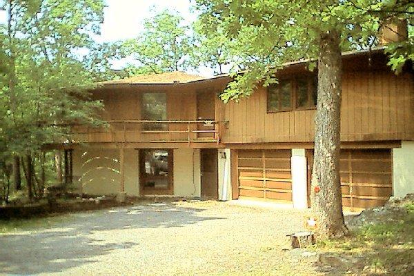 930-14 Decker Road Bushkill, PA 18324 - Photo 1 of 7 a house that has a tree in front of it