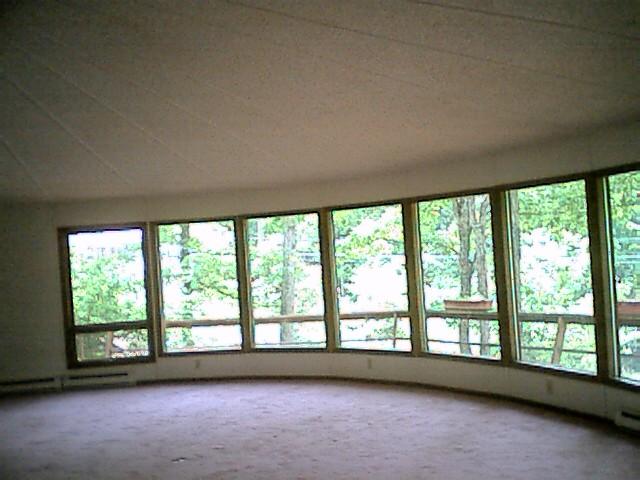 930-14 Decker Road Bushkill, PA 18324 - Photo 4 of 7 an empty room with large windows