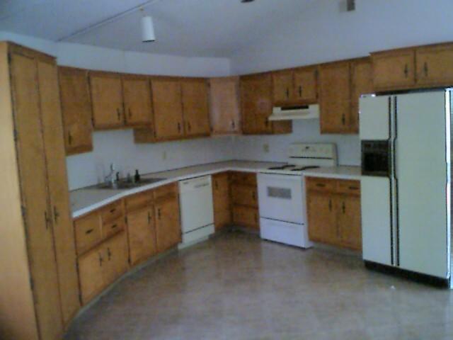 930-14 Decker Road Bushkill, PA 18324 - Photo 5 of 7 a kitchen with a sink stove and refrigerator