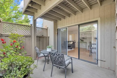 a outdoor space with patio couch and chairs
