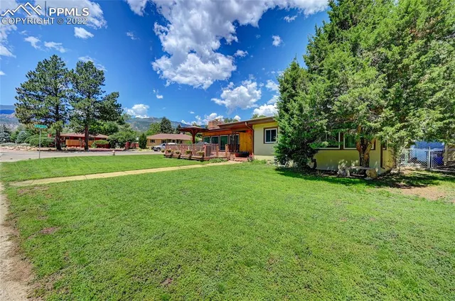 a view of a house with a big yard