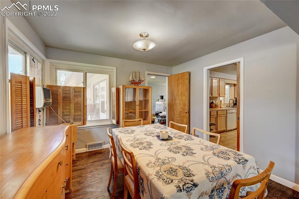 630 West Cheyenne Road Colorado Springs, CO 80906 - Photo 5 of 15 a bed sitting in a spacious bedroom next to a window