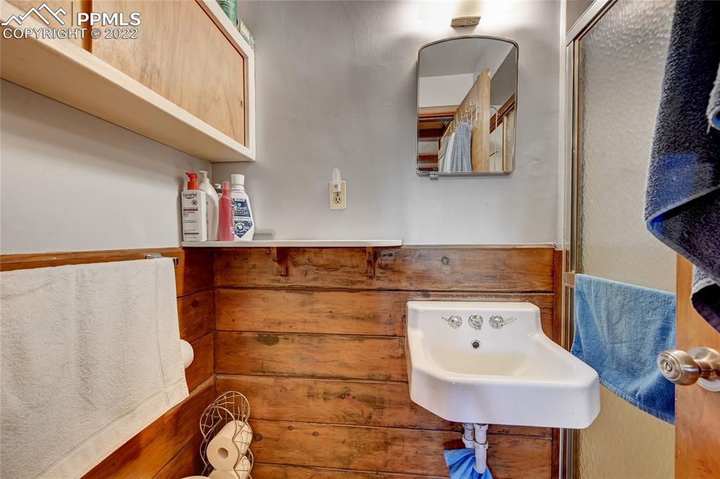 630 West Cheyenne Road Colorado Springs, CO 80906 - Photo 8 of 15 a bathroom with a sink and a mirror