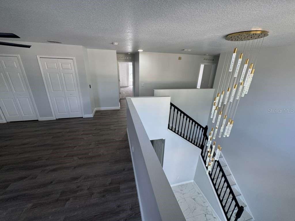 2579 Hunley Loop Kissimmee, FL 34743 - Photo 13 of 35 a view of entryway with wooden floor
