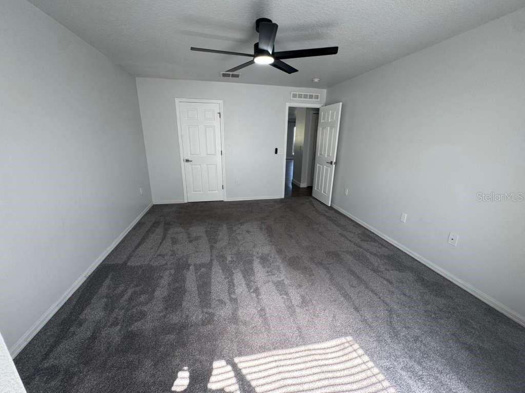 2579 Hunley Loop Kissimmee, FL 34743 - Photo 23 of 35 a view of an empty room with a window