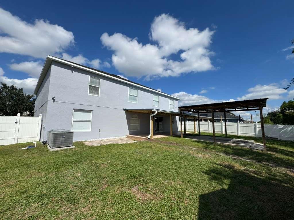 2579 Hunley Loop Kissimmee, FL 34743 - Photo 35 of 35 a front view of house with yard