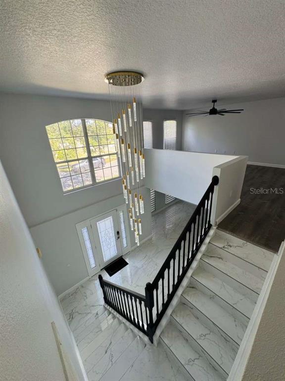2579 Hunley Loop Kissimmee, FL 34743 - Photo 9 of 35 a view of entryway and hall with wooden floor
