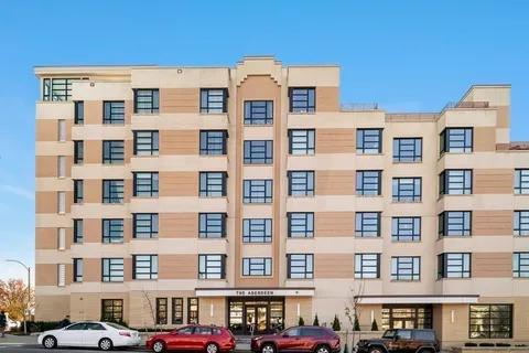 a front view of a building with glass windows