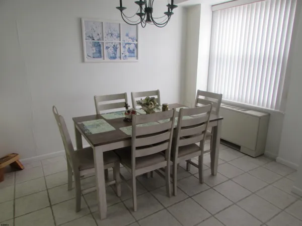 a view of a dining room with furniture and window