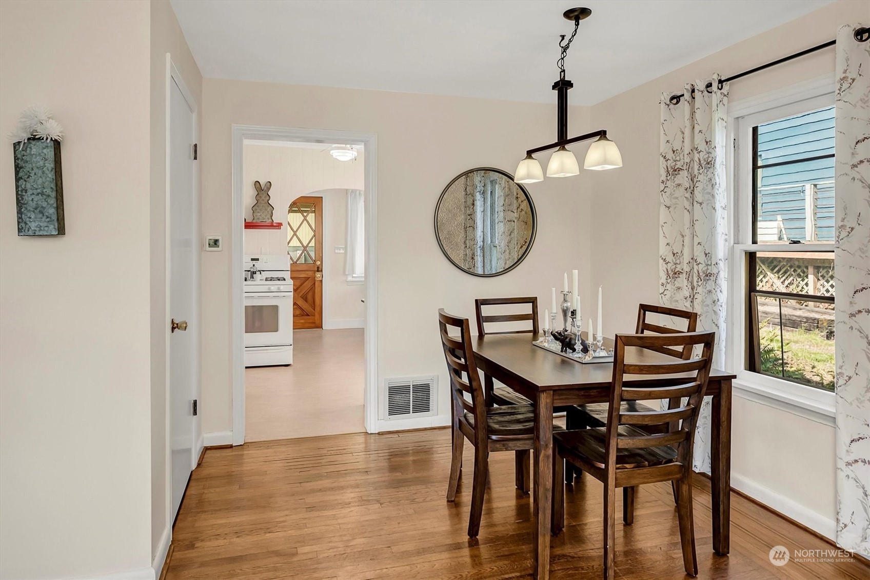 5051 40th Avenue Southwest Seattle, WA 98136 - Photo 11 of 40 a view of a dining room with furniture and a window