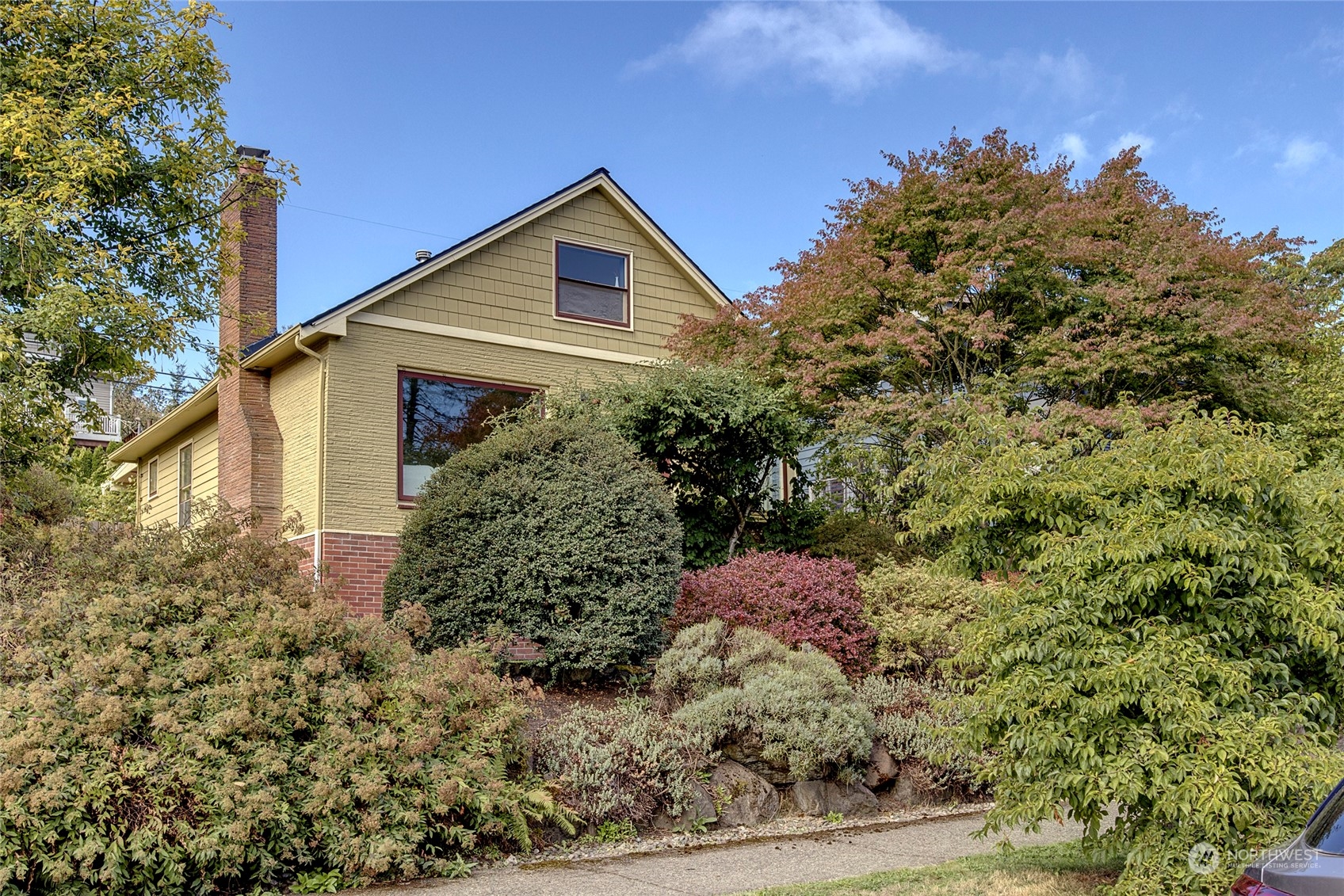 5051 40th Avenue Southwest Seattle, WA 98136 - Photo 2 of 40 a front view of a house with a yard