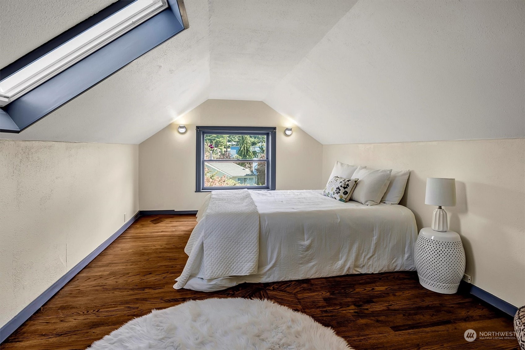 5051 40th Avenue Southwest Seattle, WA 98136 - Photo 27 of 40 a bedroom with a bed and window