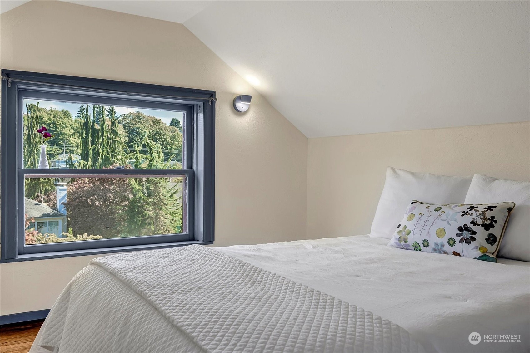 5051 40th Avenue Southwest Seattle, WA 98136 - Photo 28 of 40 a bedroom with a large bed and a large window