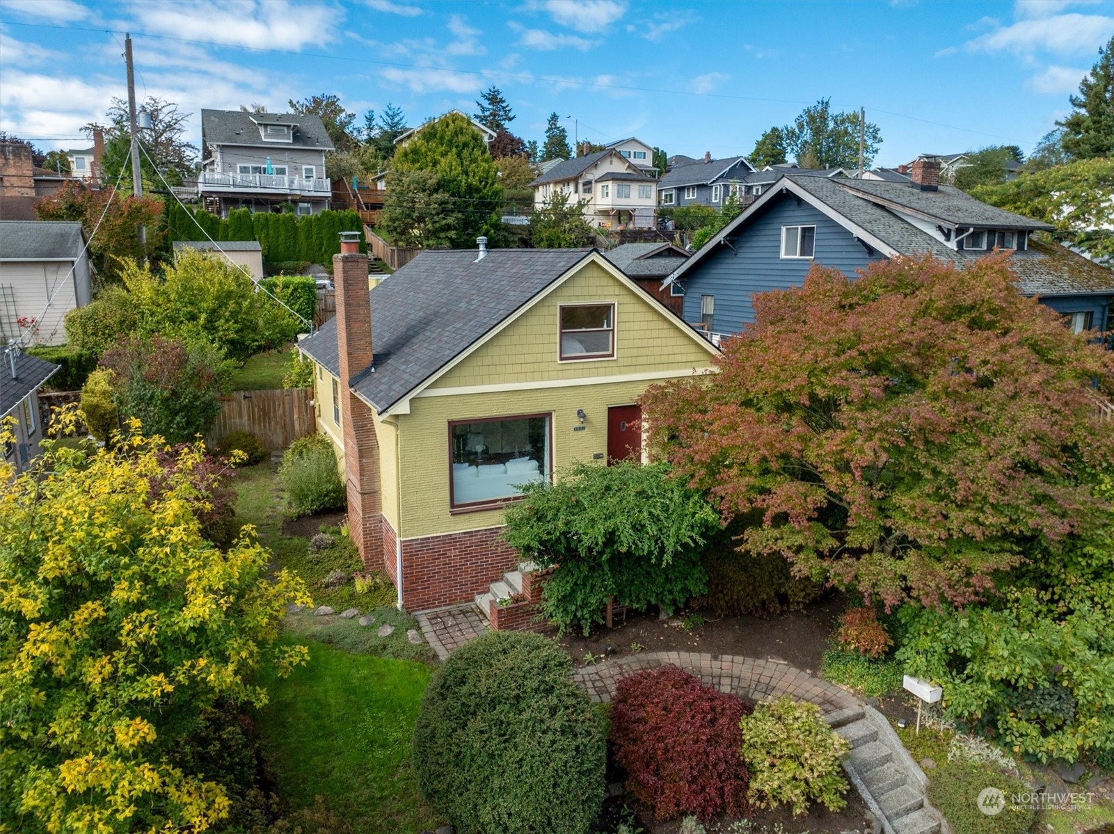 5051 40th Avenue Southwest Seattle, WA 98136 - Photo 37 of 40 a front view of a house with a yard