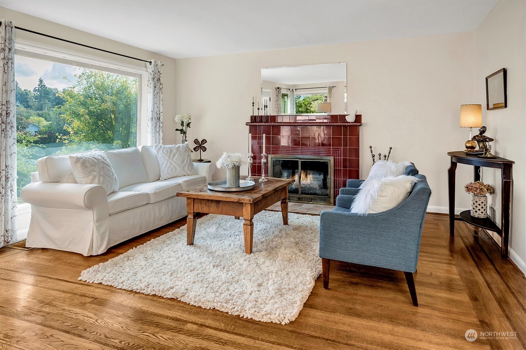 5051 40th Avenue Southwest Seattle, WA 98136 - Photo 4 of 40 a living room with furniture and a fireplace