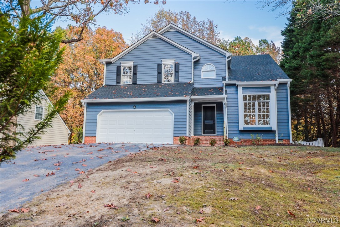 14900 Sandstone Ridge Court Midlothian, VA 23112 - Photo 2 of 50 a front view of a house with a yard and garage