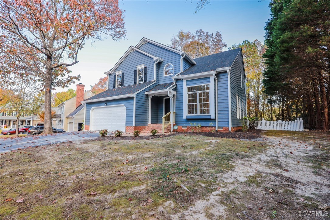 14900 Sandstone Ridge Court Midlothian, VA 23112 - Photo 3 of 50 a front view of a house with a yard