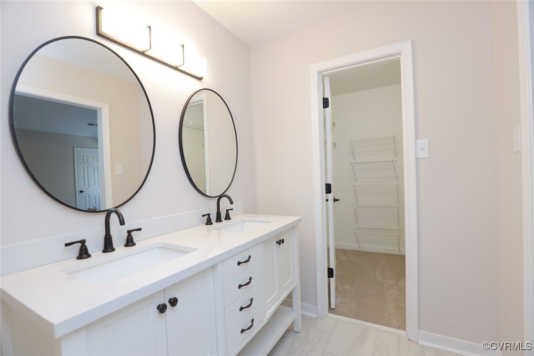 14900 Sandstone Ridge Court Midlothian, VA 23112 - Photo 31 of 50 a bathroom with a sink and a mirror