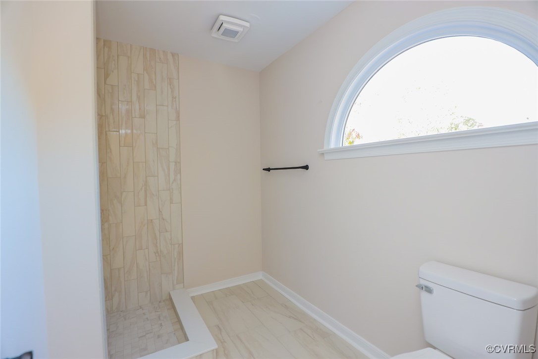 14900 Sandstone Ridge Court Midlothian, VA 23112 - Photo 32 of 50 a bathroom with a toilet and a window