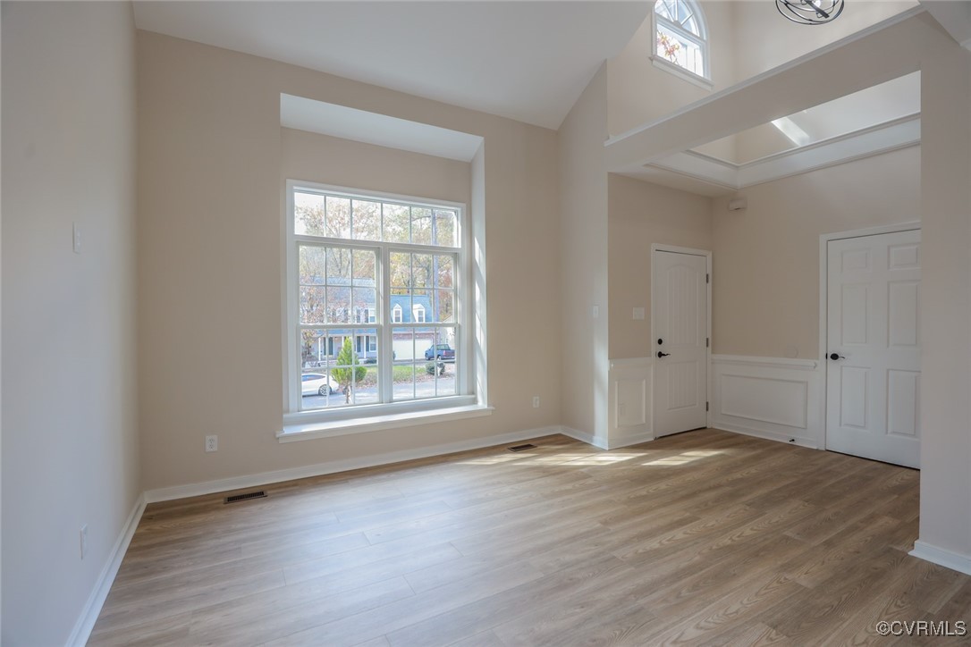 14900 Sandstone Ridge Court Midlothian, VA 23112 - Photo 6 of 50 an empty room with wooden floor and windows
