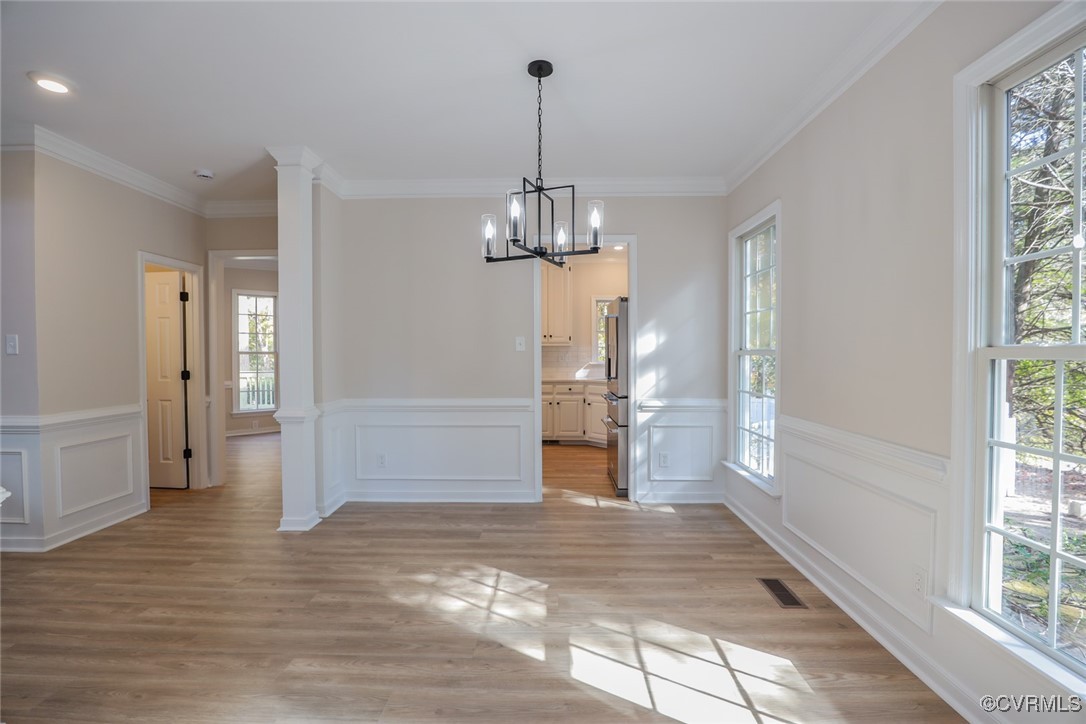 14900 Sandstone Ridge Court Midlothian, VA 23112 - Photo 8 of 50 a view of a hallway with wooden floor and a chandelier