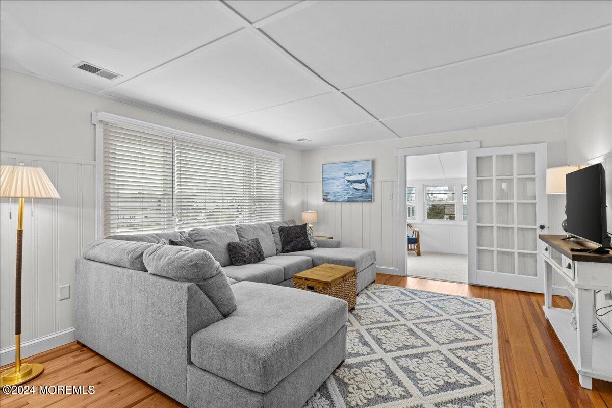 51 3rd Avenue Lavallette, NJ 08735 - Photo 12 of 36 a living room with furniture and a flat screen tv