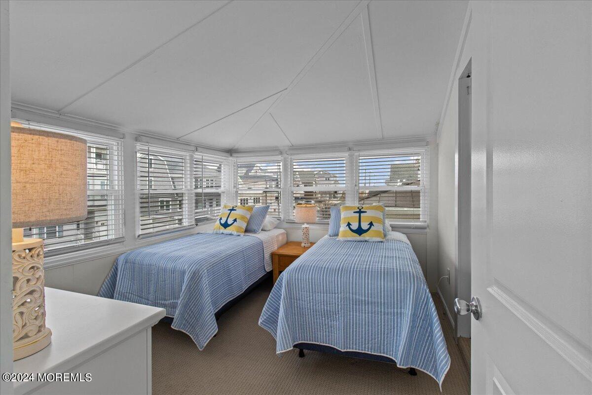 51 3rd Avenue Lavallette, NJ 08735 - Photo 20 of 36 a bedroom with furniture and a window