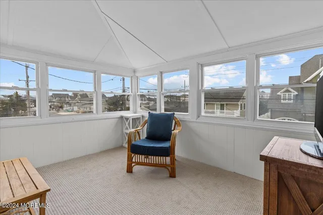 a view of roof deck with patio
