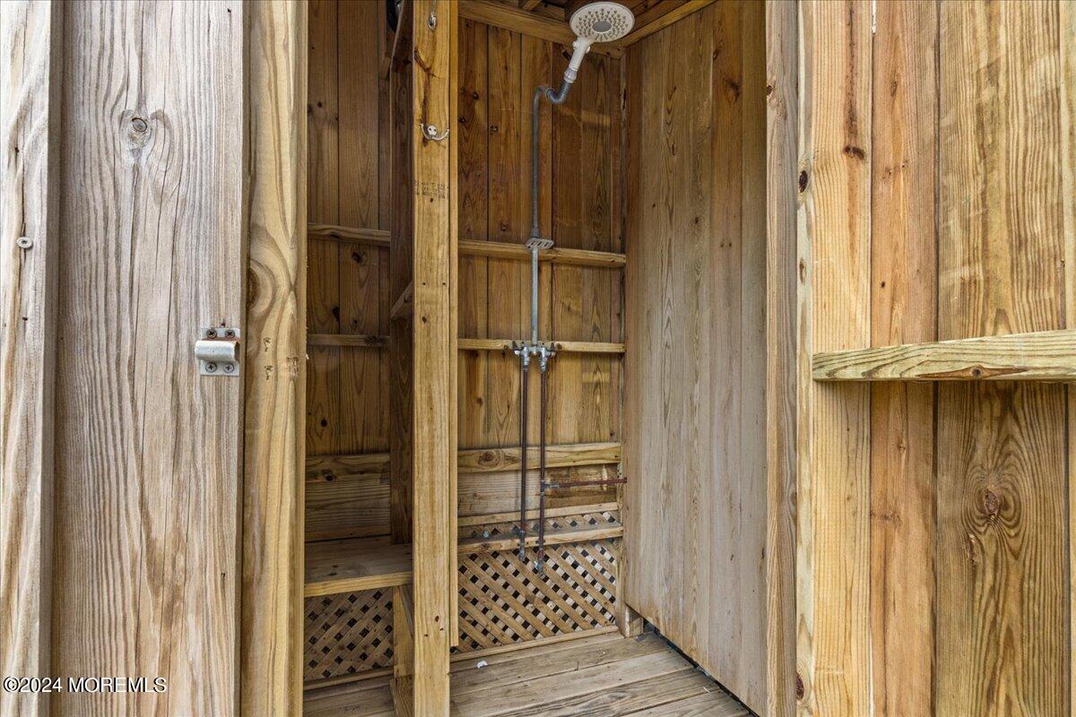 51 3rd Avenue Lavallette, NJ 08735 - Photo 36 of 36 a view of walk in closet with chandelier