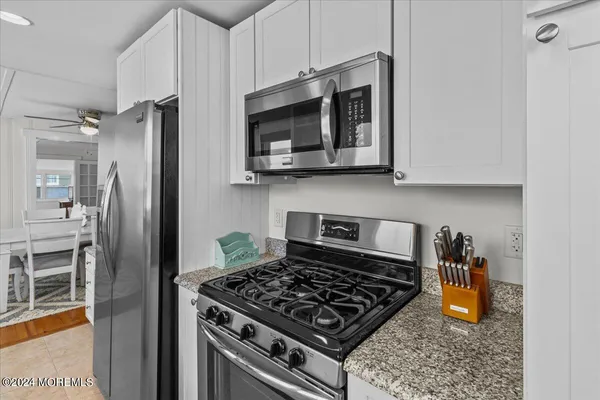a kitchen with a stove and a sink