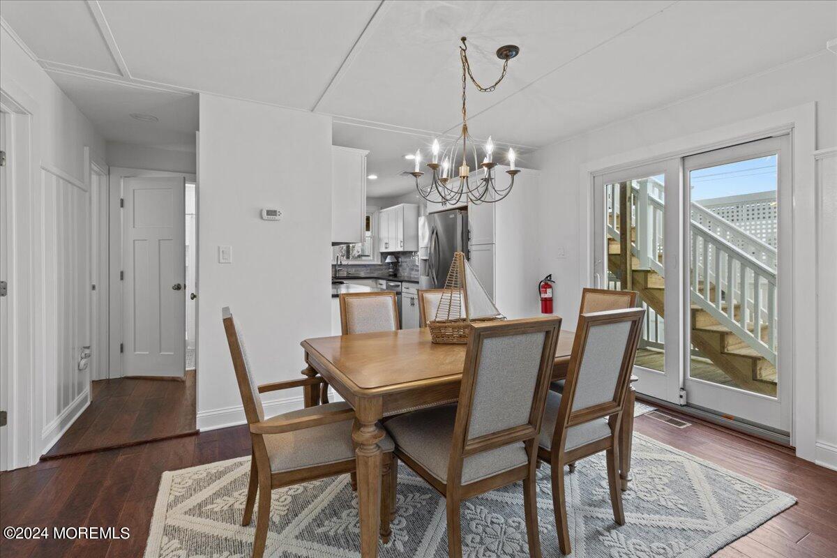 51 3rd Avenue Lavallette, NJ 08735 - Photo 8 of 36 a view of a dining room with furniture and wooden floor