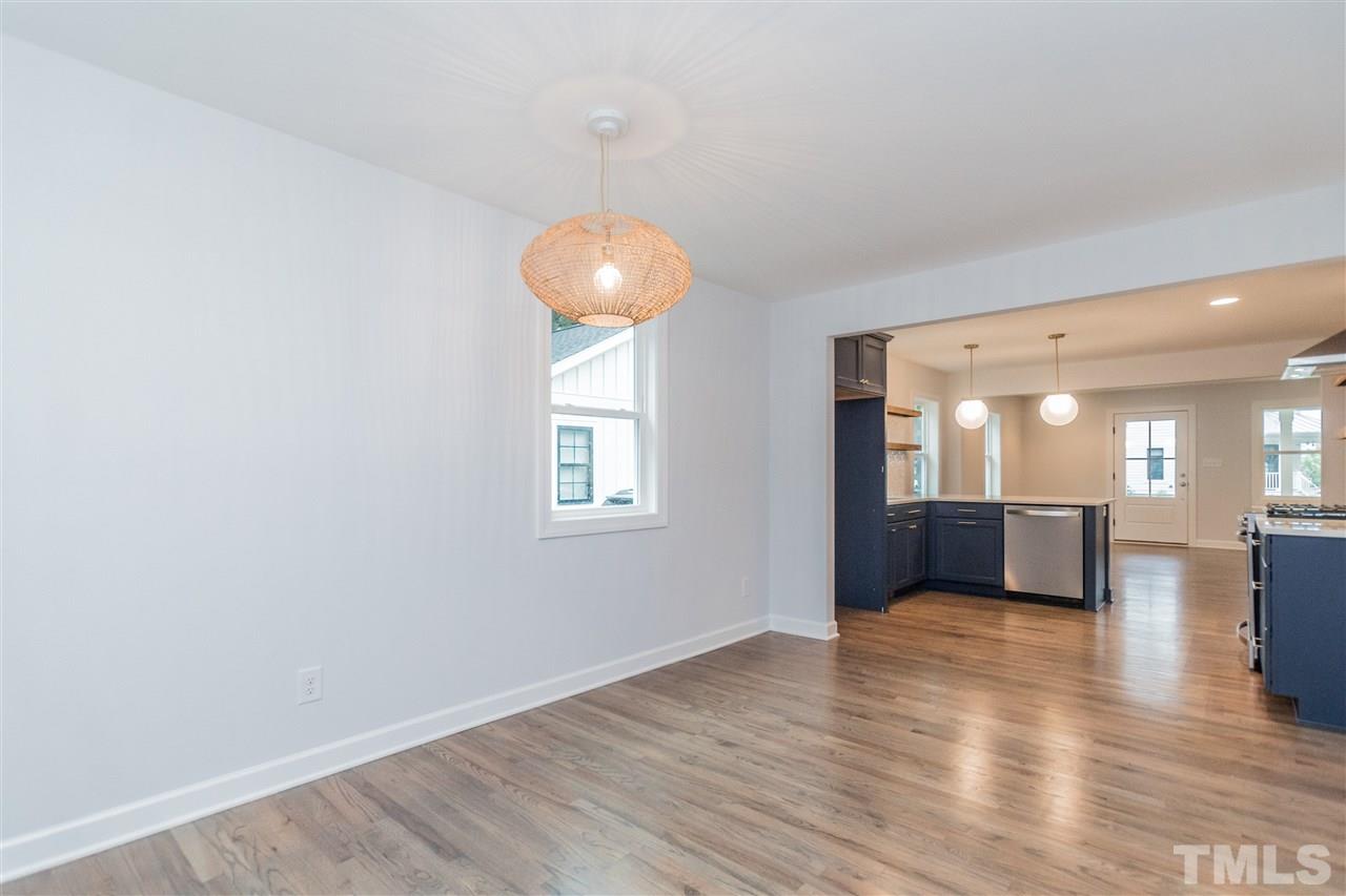 915 Elm Street Raleigh, NC 27604 - Photo 13 of 25 a view of a livingroom with furniture wooden floor and window