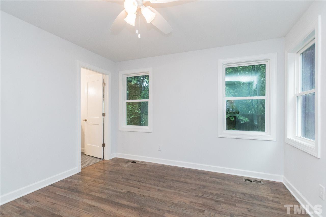 915 Elm Street Raleigh, NC 27604 - Photo 15 of 25 an empty room with wooden floor and windows