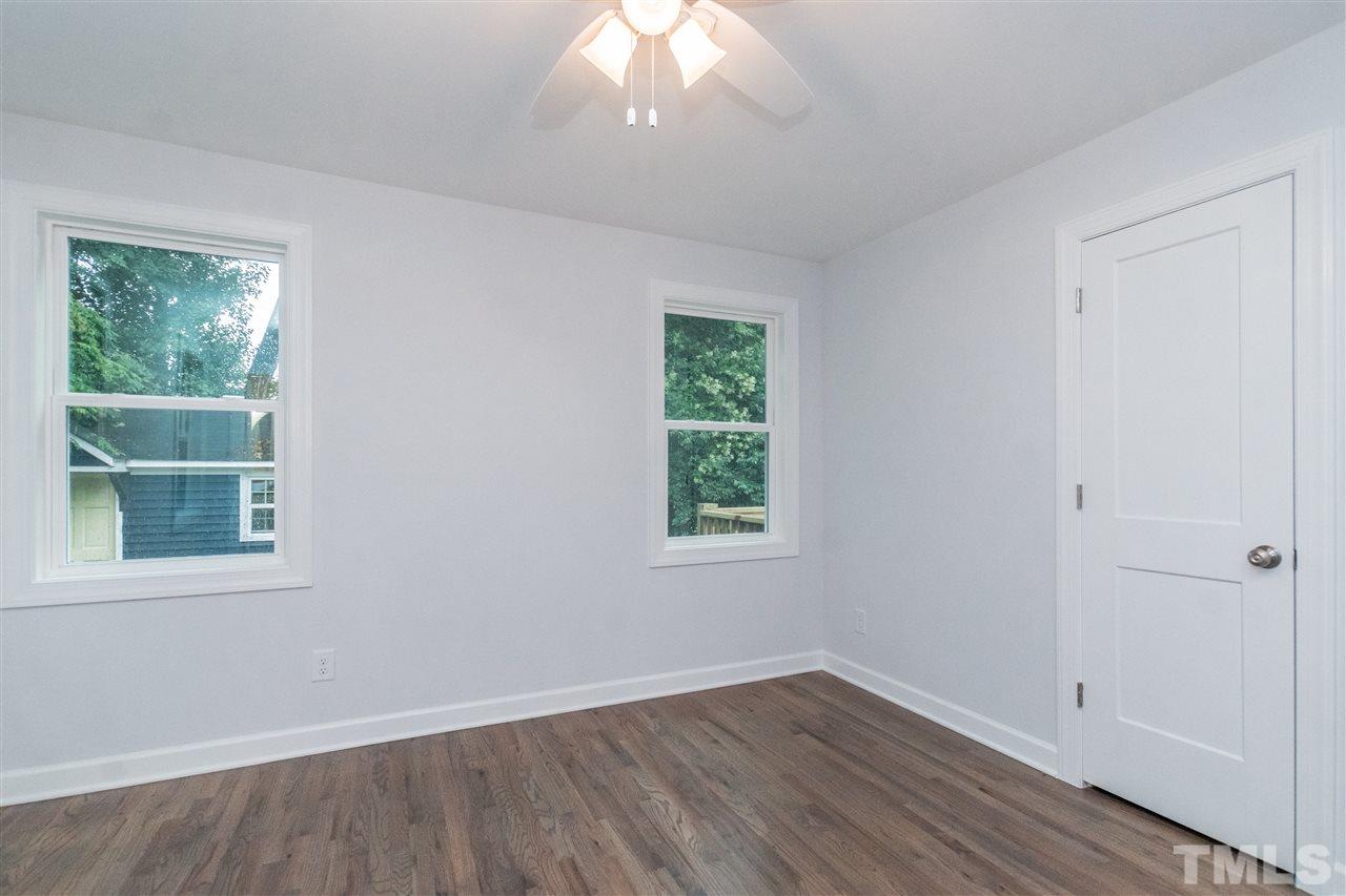 915 Elm Street Raleigh, NC 27604 - Photo 16 of 25 an empty room with wooden floor and windows