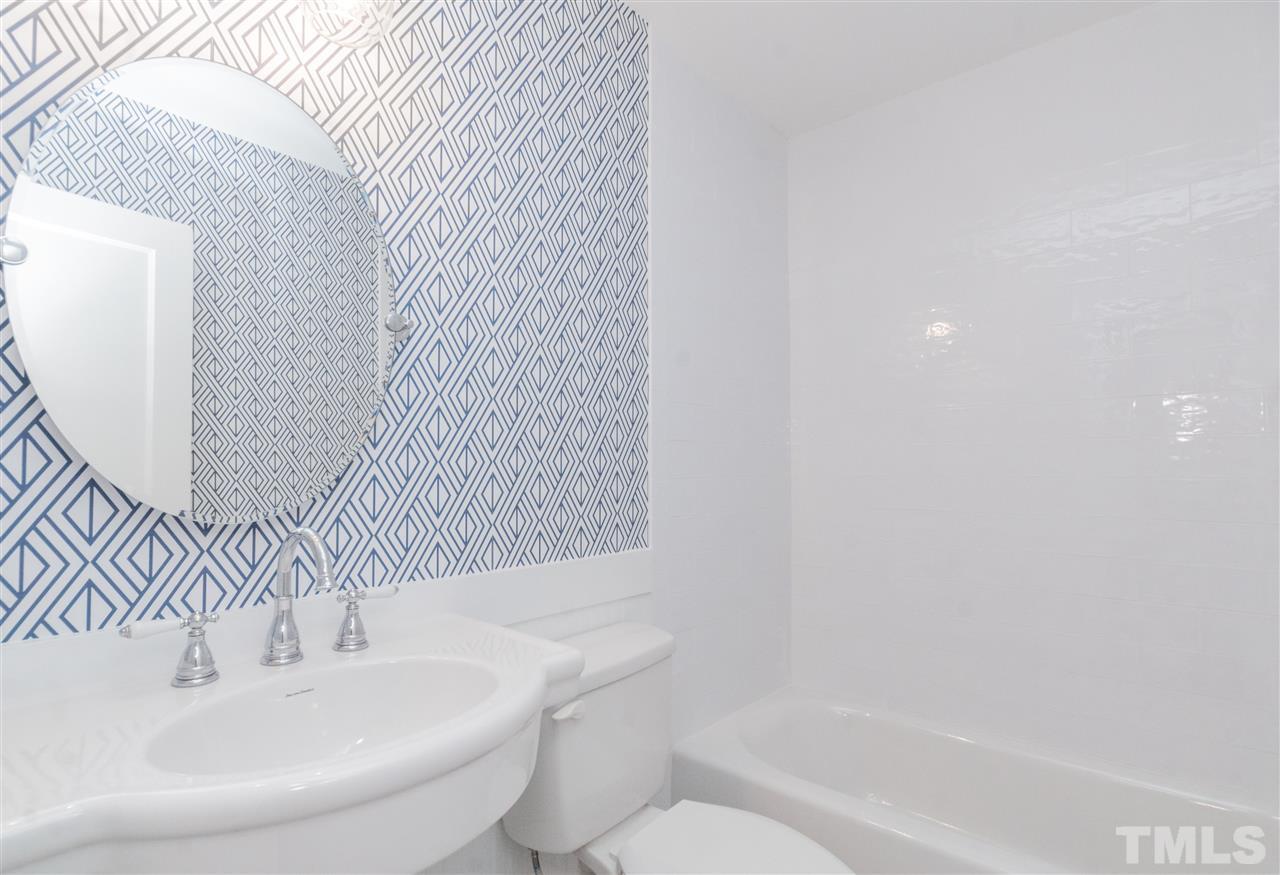915 Elm Street Raleigh, NC 27604 - Photo 20 of 25 a bathroom with a sink and a mirror