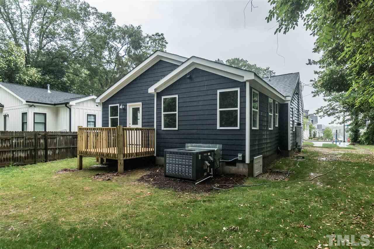 915 Elm Street Raleigh, NC 27604 - Photo 24 of 25 a backyard of a house with yard and seating space