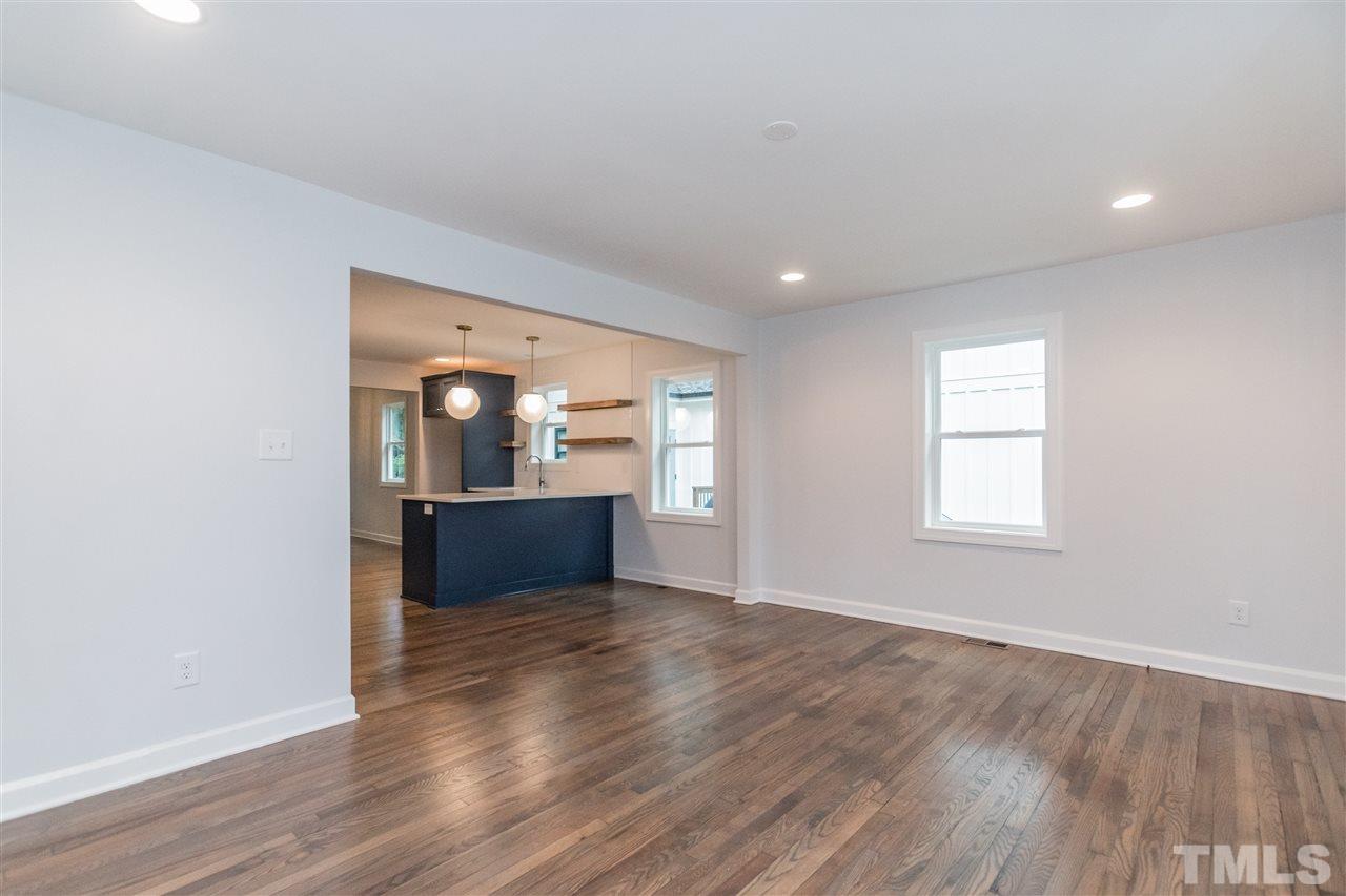 915 Elm Street Raleigh, NC 27604 - Photo 6 of 25 an empty room with wooden floor and entrance